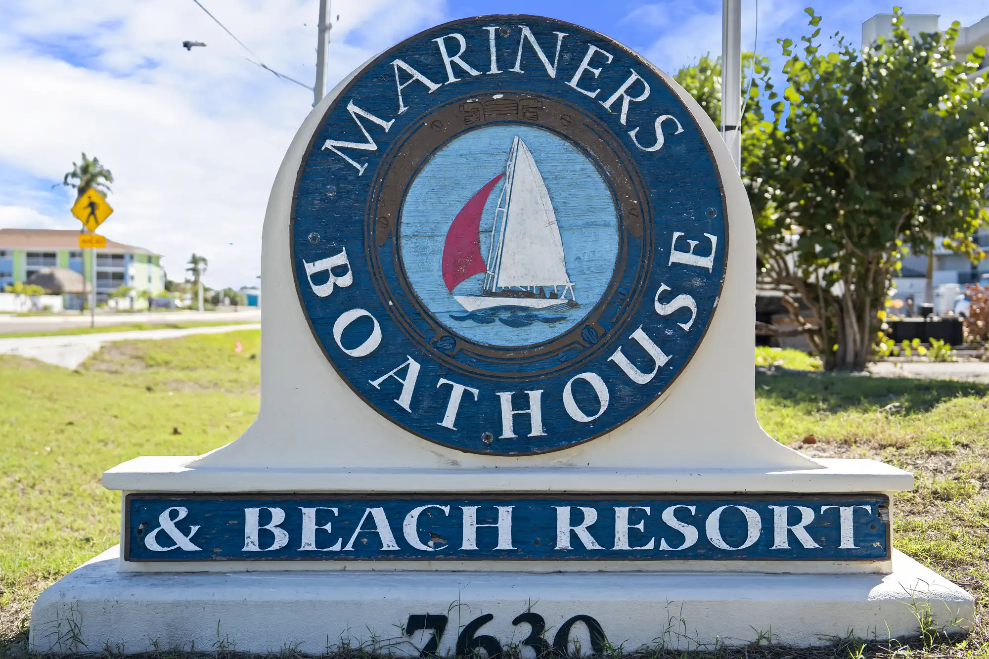Mariners Boathouse & Beach Resort entrance sign with a sailboat logo