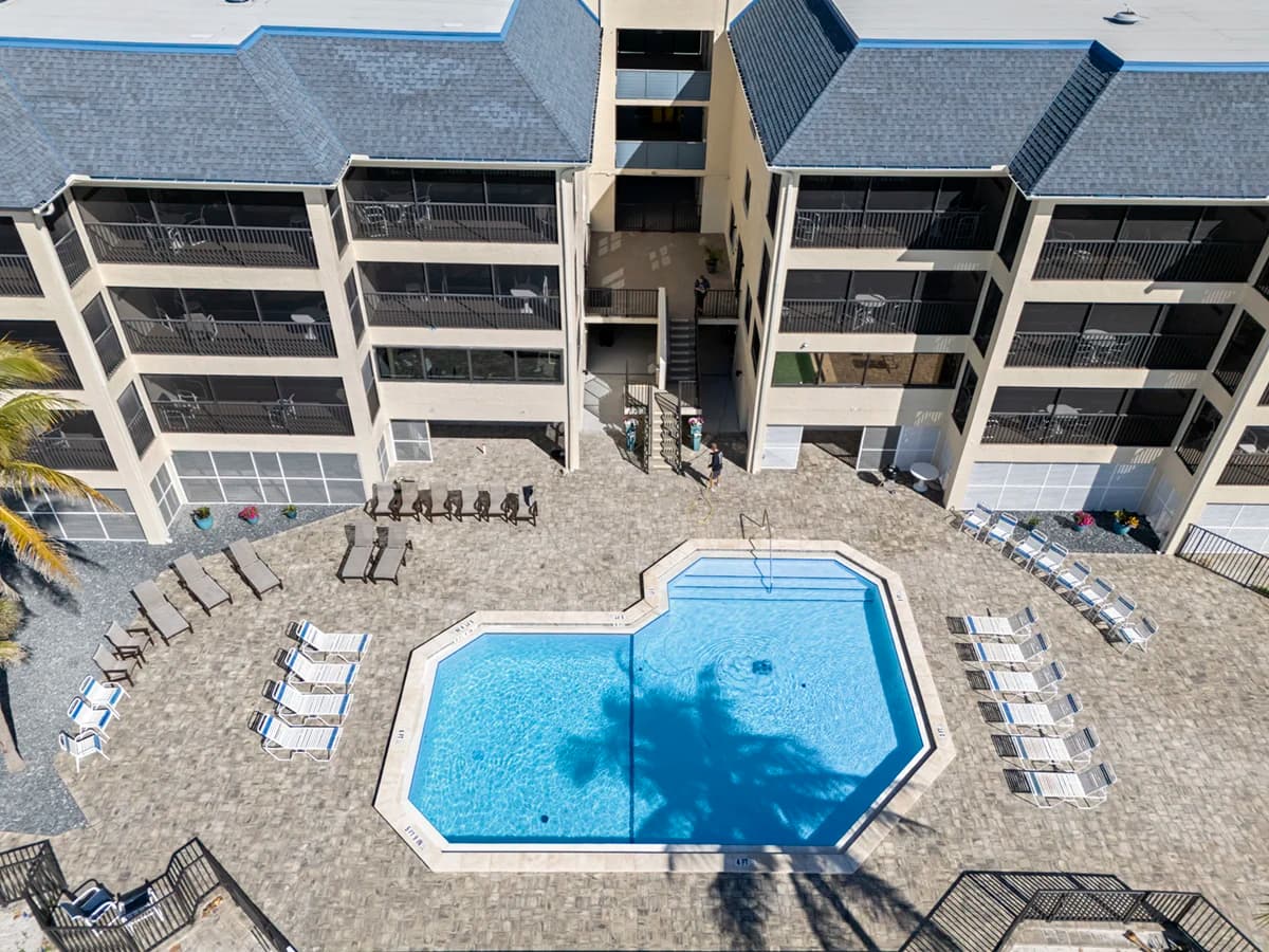 Dining area with built-in wooden bunk beds and open view toward the kitchen